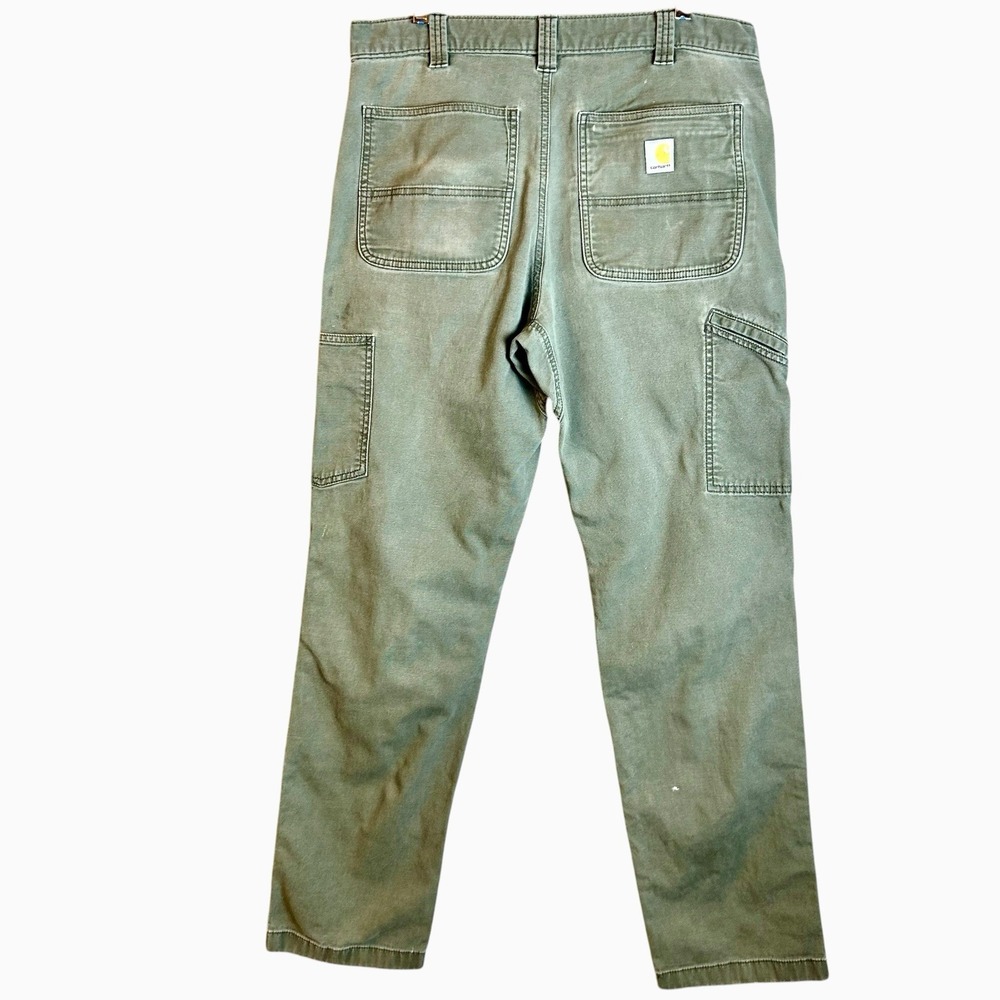Faded double knee Carhartt relaxed fit canvas green pants Size 34x34 Fits 32x32